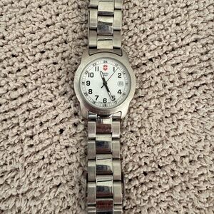 Victorious Silver Stainless Steel Watch White Face Women’s Needs battery.